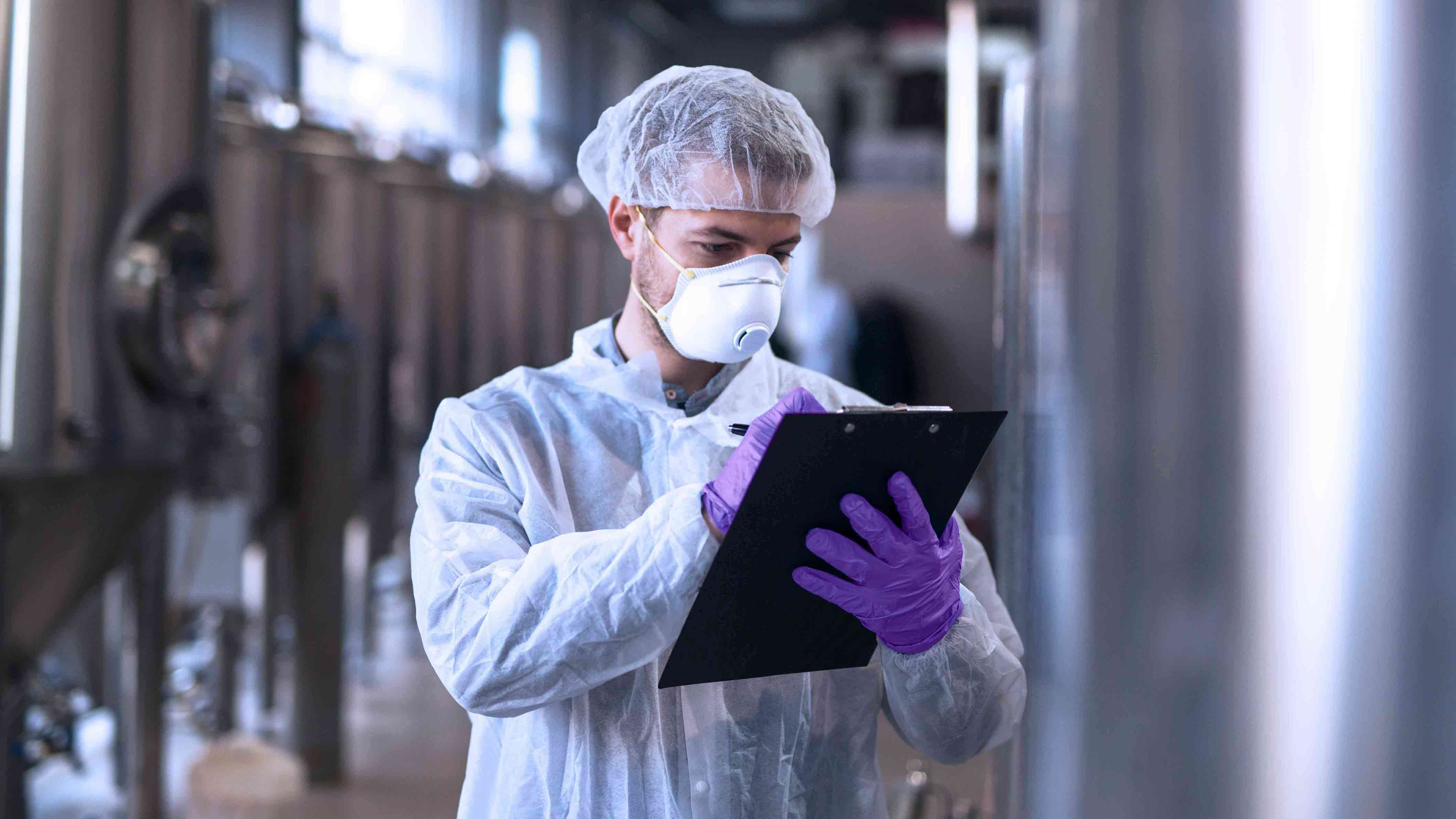 Young man with a clipboard