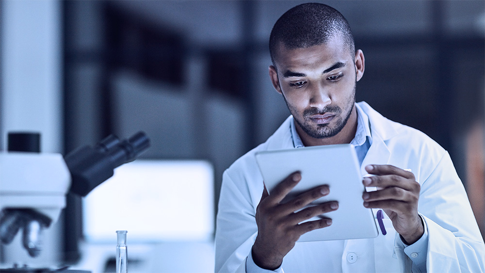 Image of man checking clipboard.