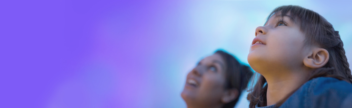 Photo of children looking to the sky. 